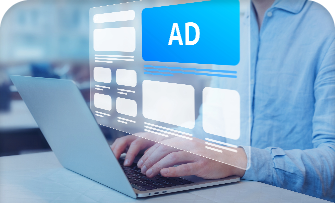 Desk with graphic design software on screen, surrounded by colorful stationery.